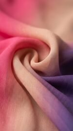 Close-up of the chiffon fading from pink to peach to purple