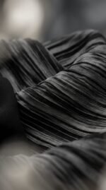 Close-up of the black pleated side panel
